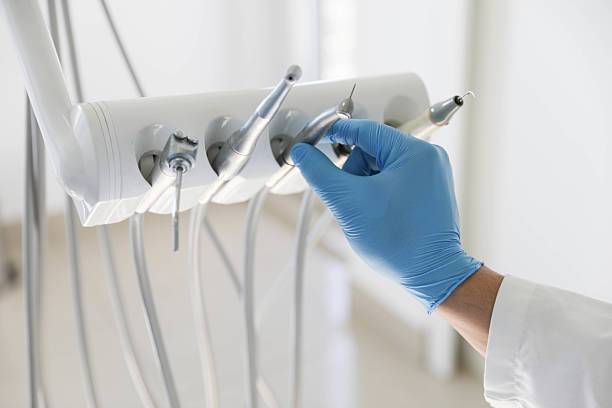 Professional Tooth Extraction technician working in Assumption, IL